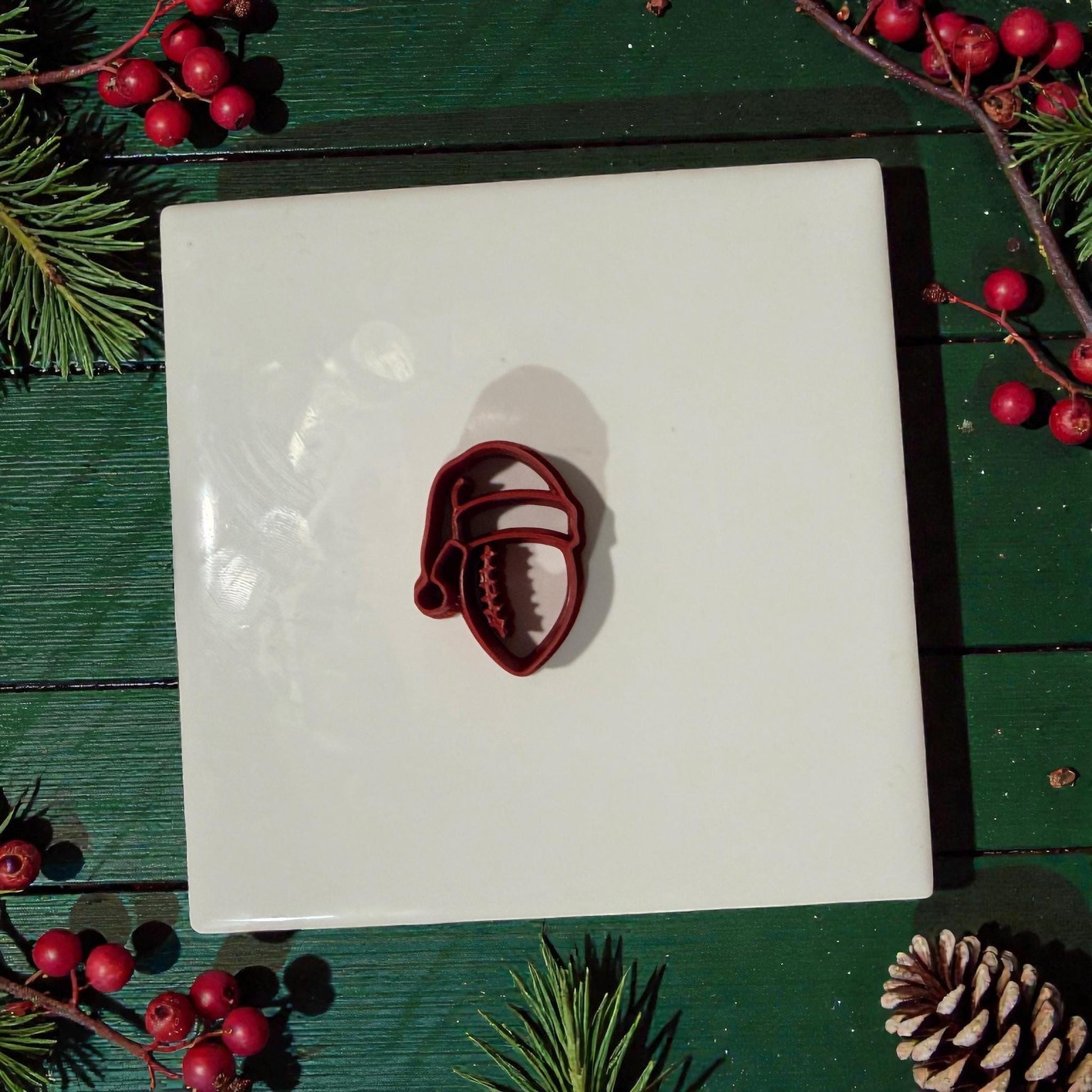 football santa hat polymer clay cutter on white tile