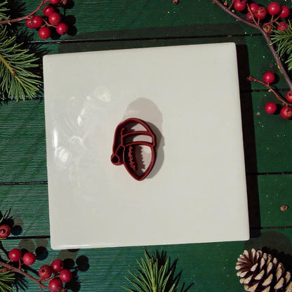 football santa hat polymer clay cutter on white tile