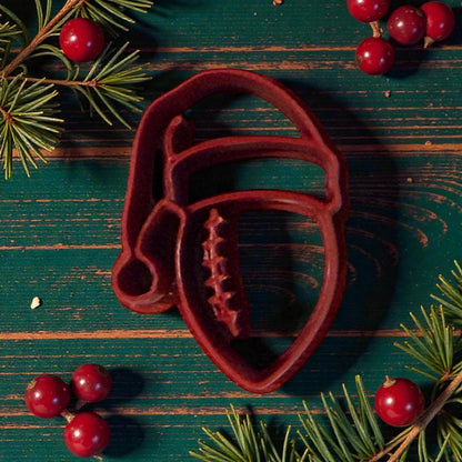 football santa hat polymer clay cutter on wooden green table