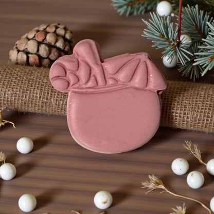 pink clay coconut christmas drink with holiday decor
