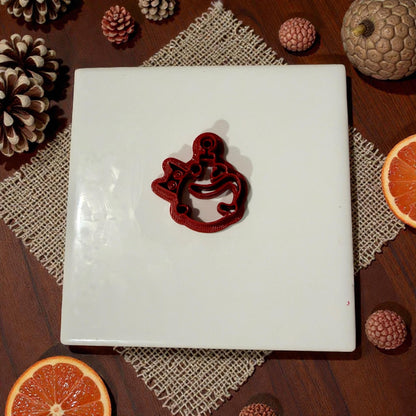 small cat ornament cutter displayed on white tile
