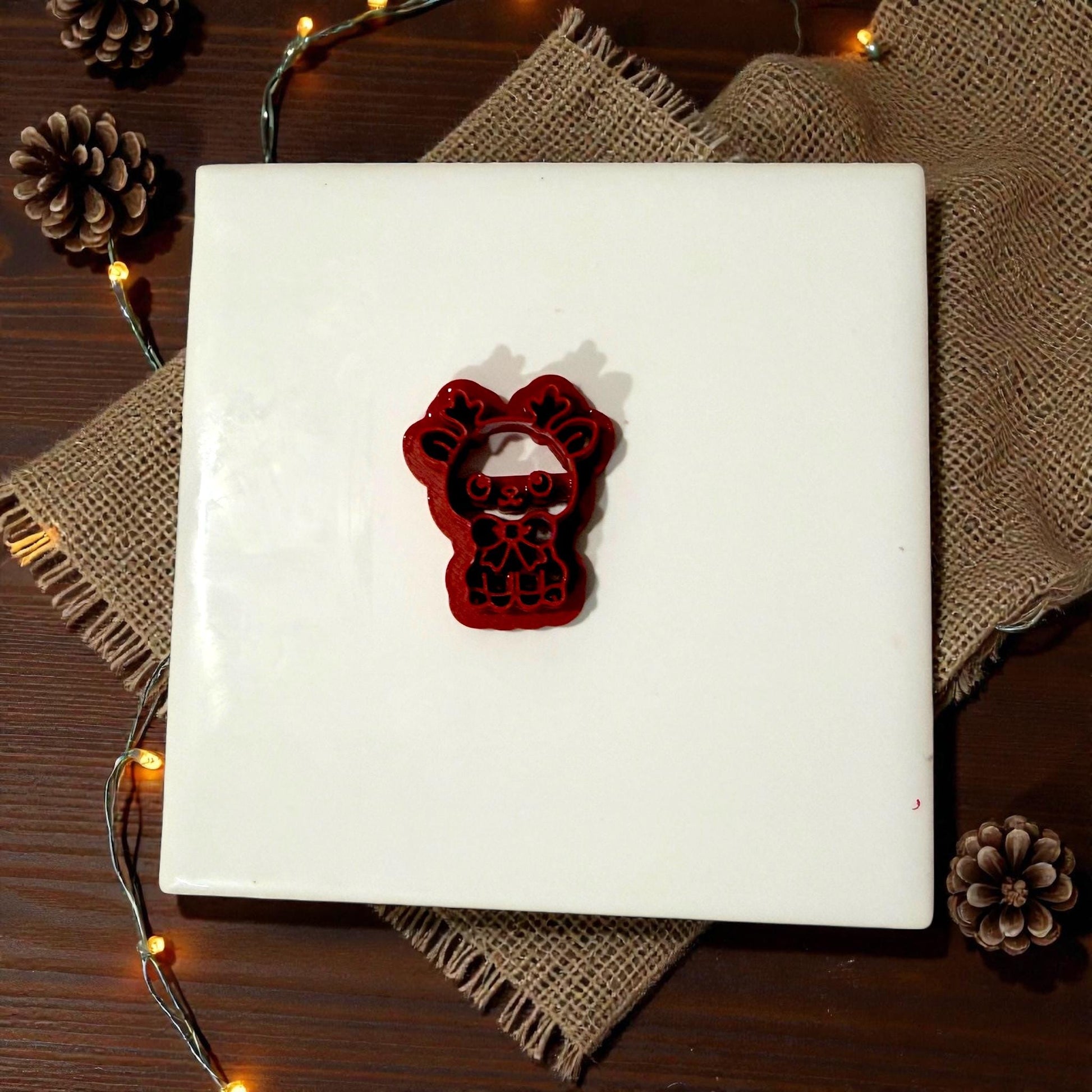 reindeer bow polymer clay cutter on white tile