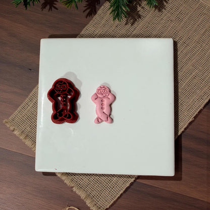 snowman cutter and clay impression on white tile