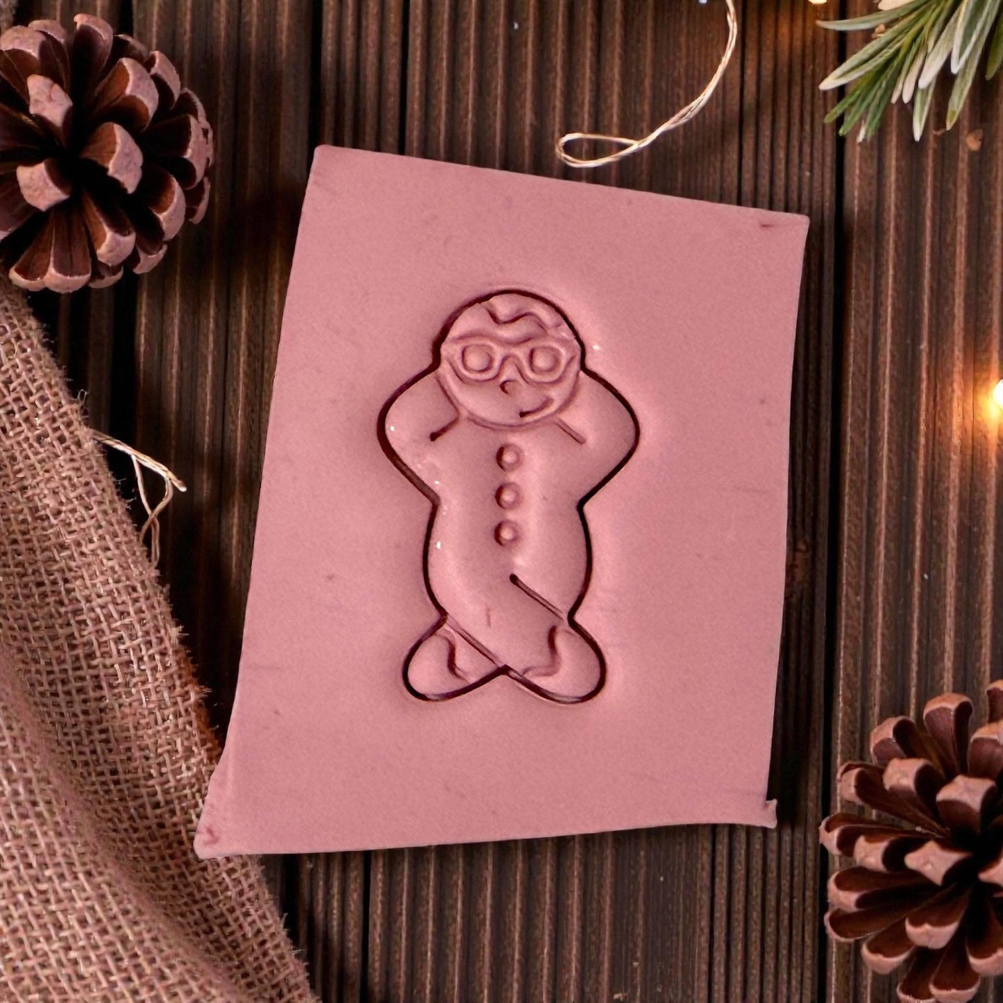 snowman clay imprint on pink slab