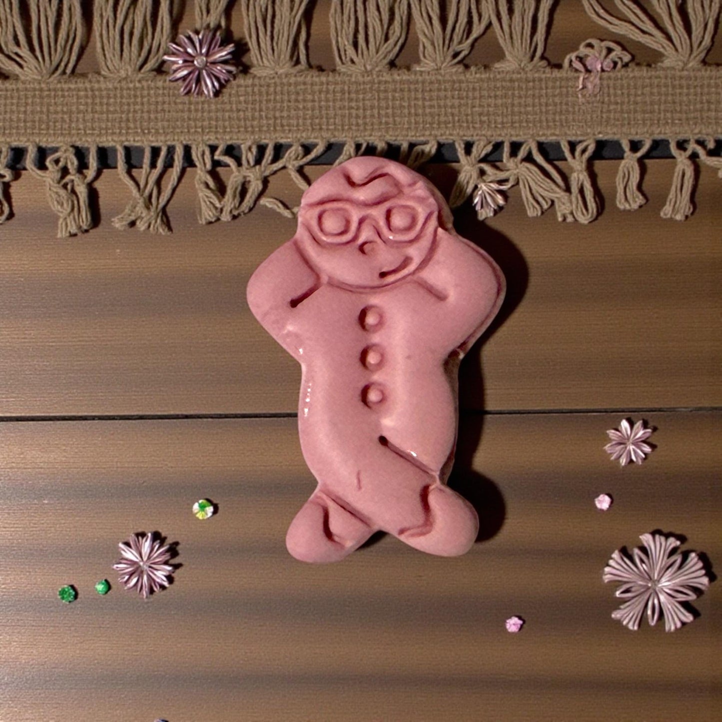 snowman clay piece on wood with fringe decor