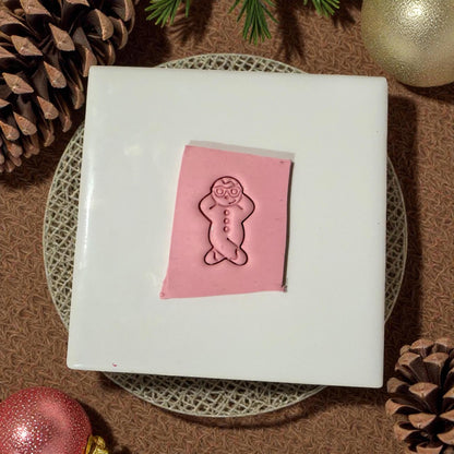 snowman clay imprint on white tile with ornaments