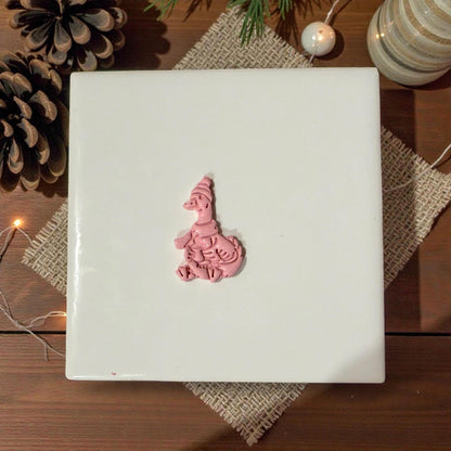winter goose clay piece centered on white tile