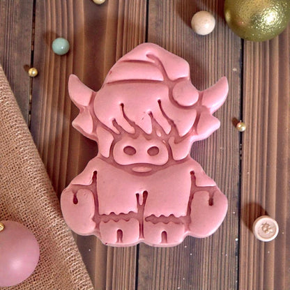 closeup pink clay highland cow impression