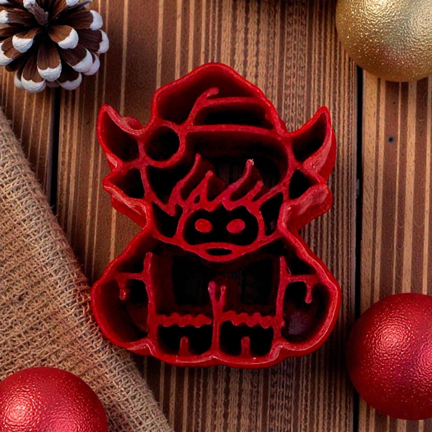 christmas highland cow polymer clay cutter on textured background