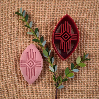 pink clay imprint and geometric cutter styled with greenery
