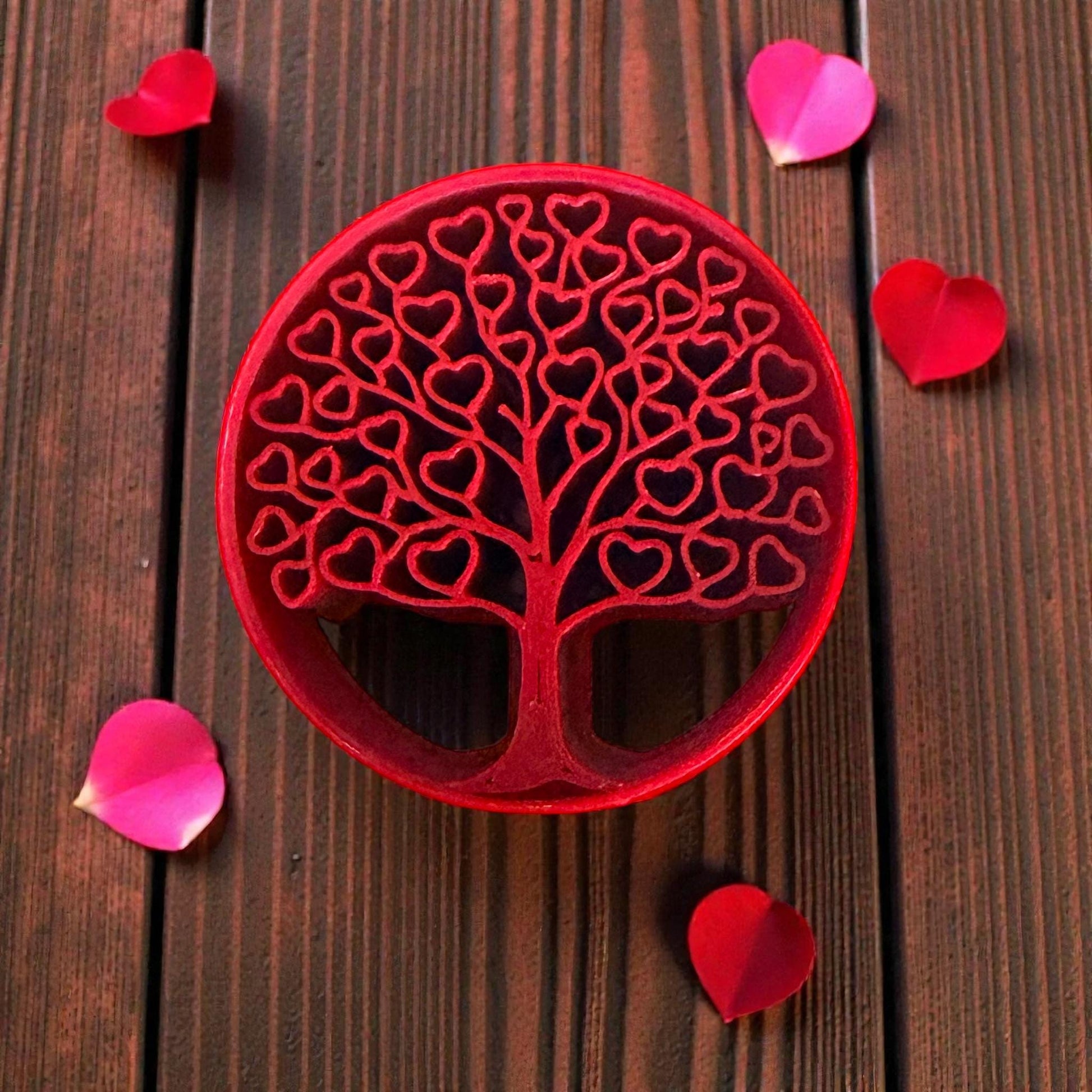 heart tree clay cutter surrounded by rose petals