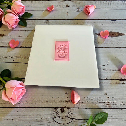 heart bouquet watering can clay impression on white tile