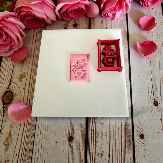 watering can floral heart polymer clay cutter on white tile