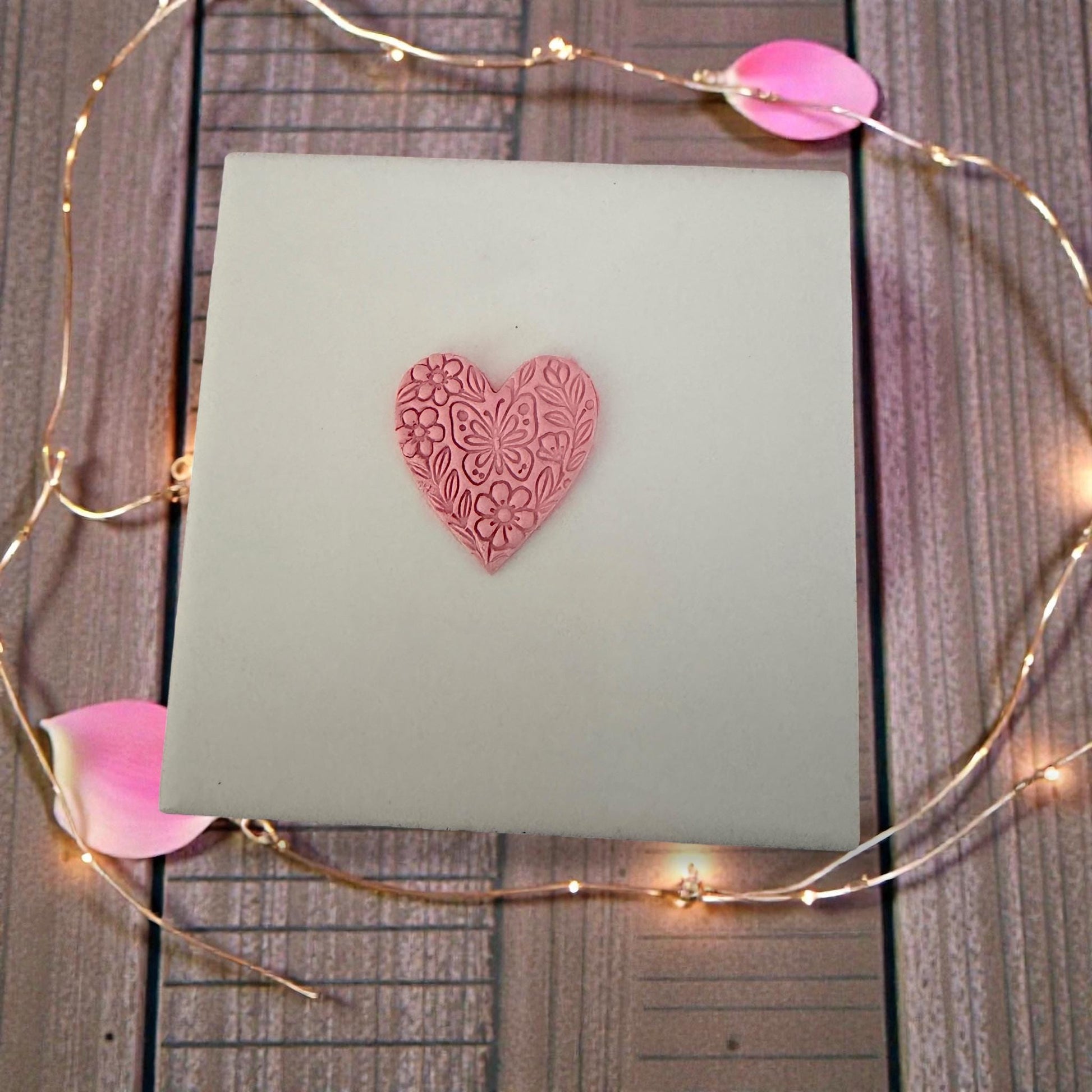 floral butterfly heart clay impression on pink slab