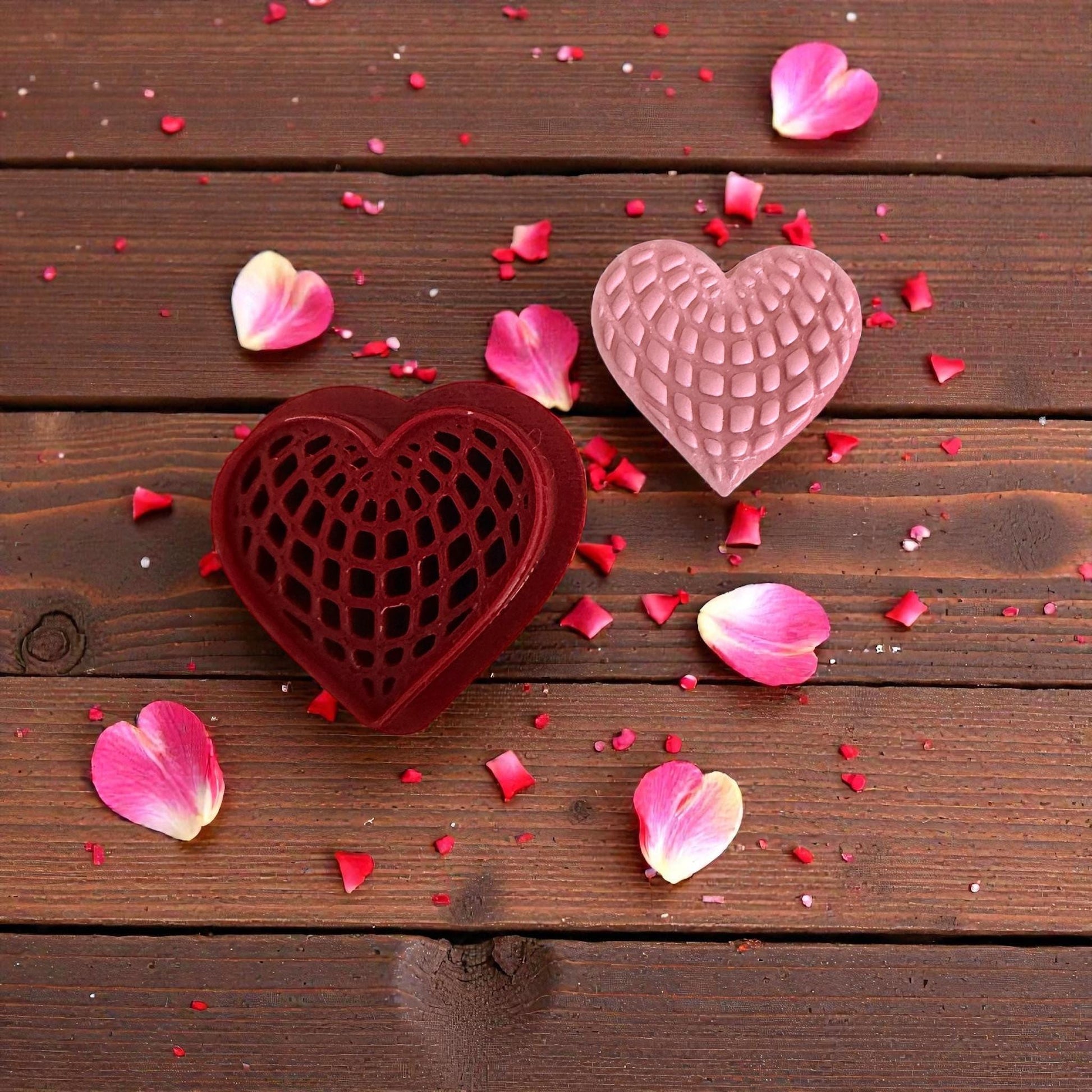 red heart web cutter displayed on white tile with scattered clay sprinkles
