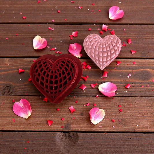 red heart web cutter displayed on white tile with scattered clay sprinkles