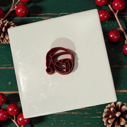 volleyball santa clay cutter sitting on white tile with holiday decor