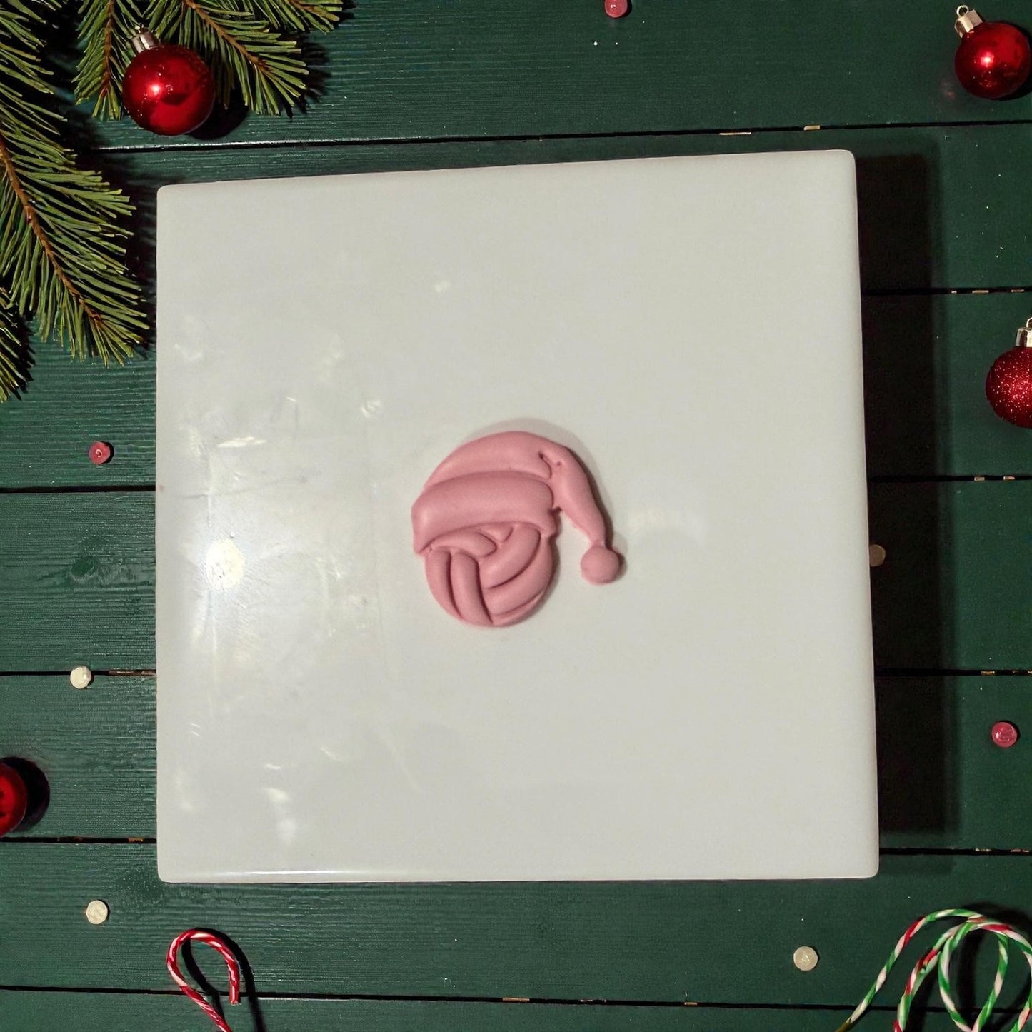 volleyball santa clay impression on tile with red ornaments