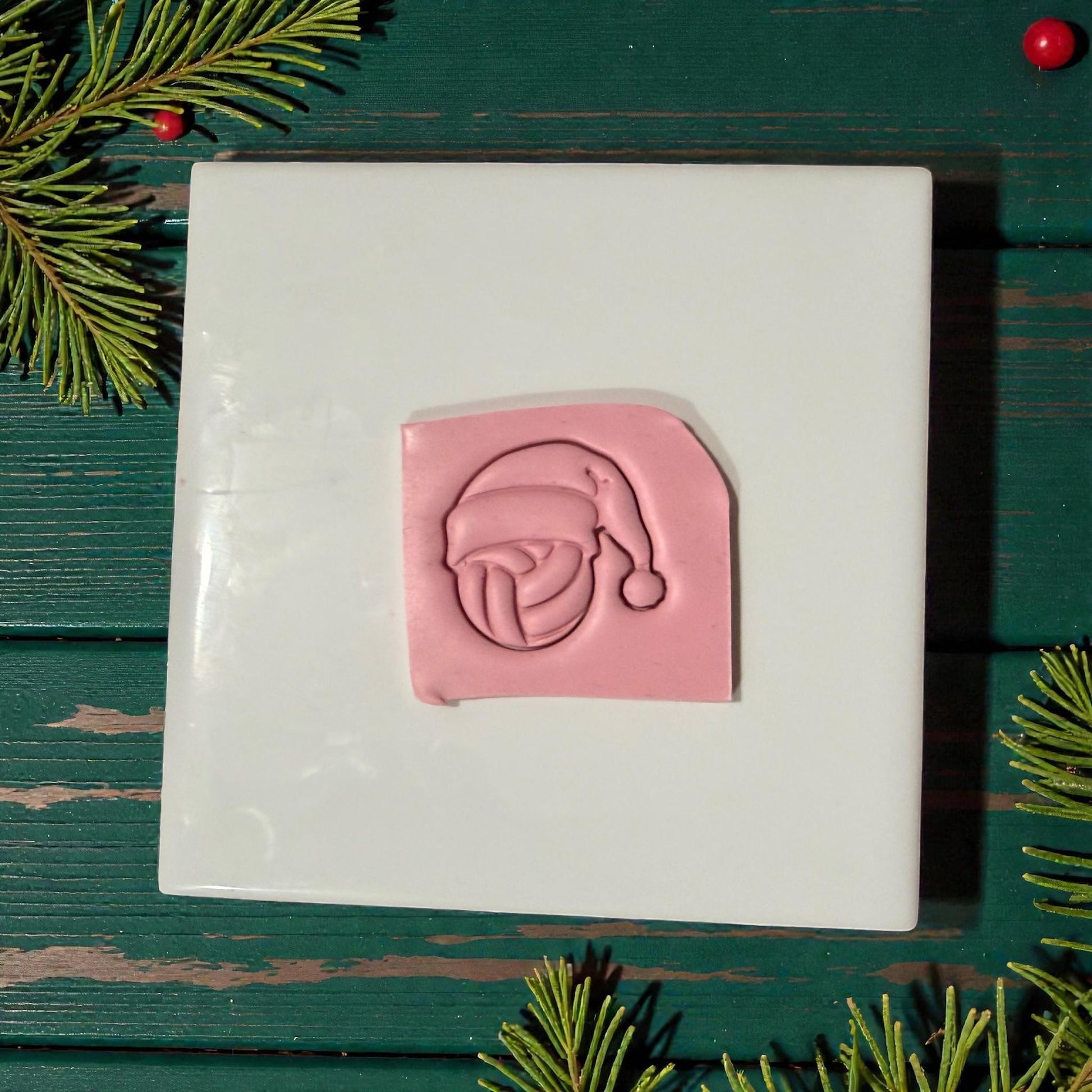 volleyball santa clay impression on white tile with greenery