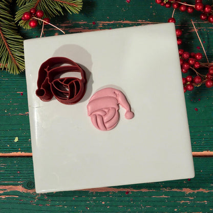 volleyball santa cutter and pink clay impression on white tile