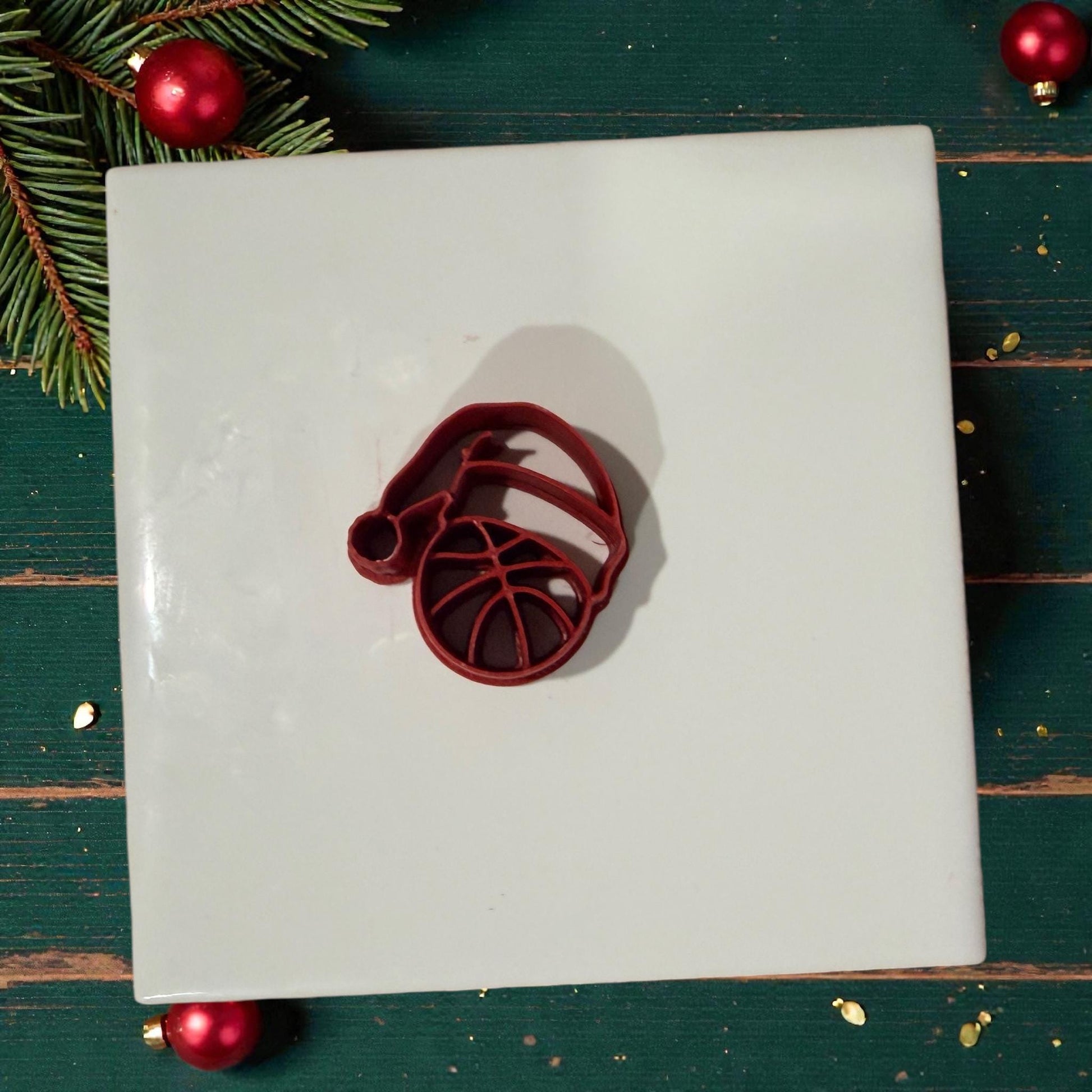basketball santa hat polymer clay cutter on white tile