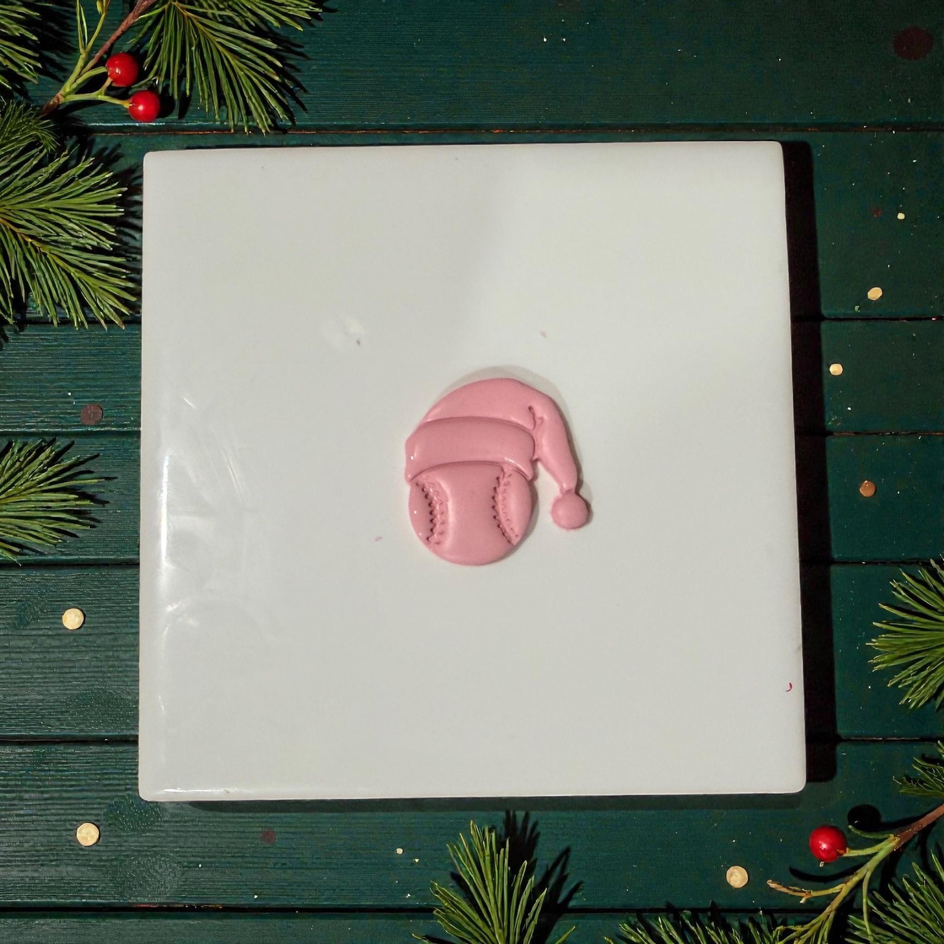 baseball santa clay design centered on white tile