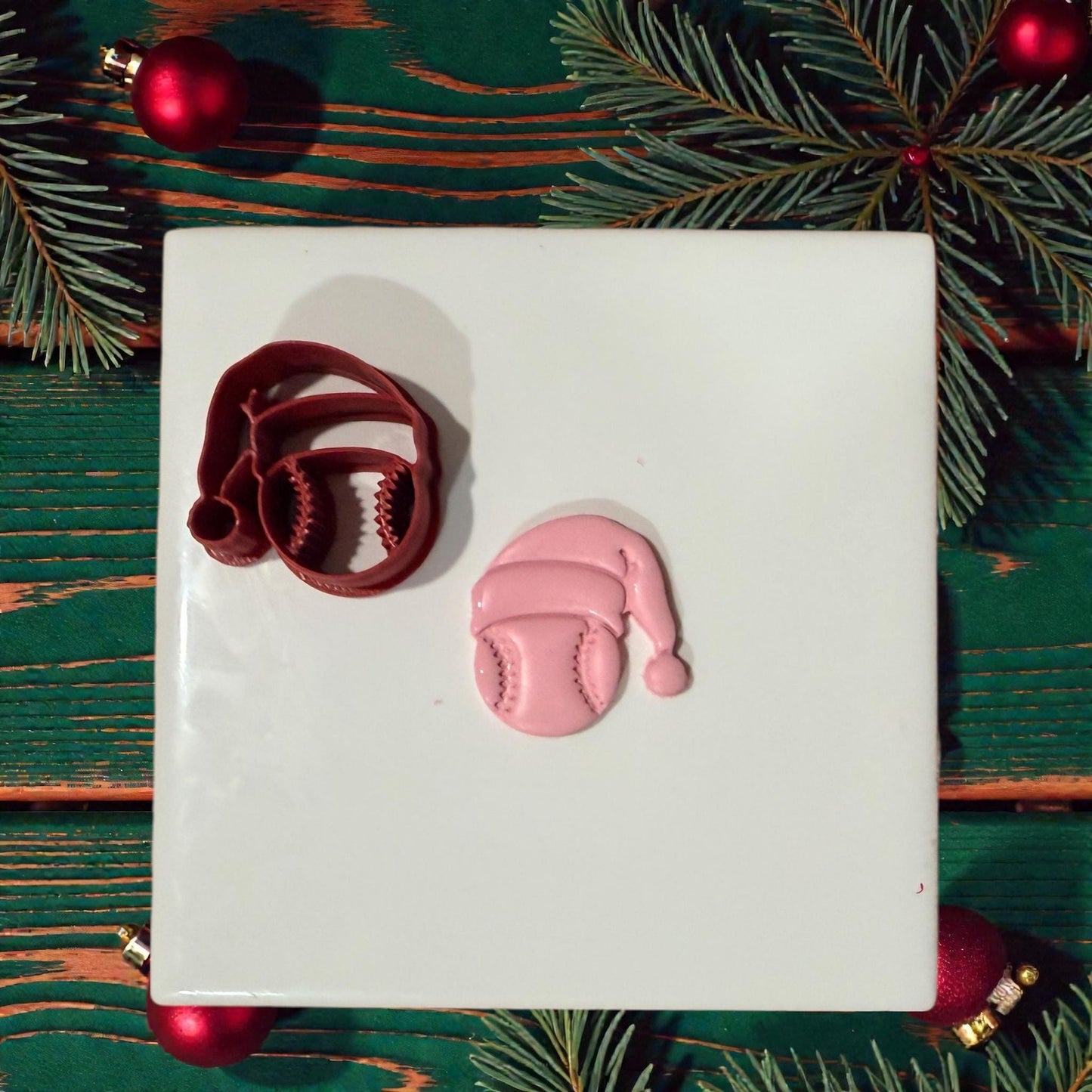 baseball santa cutter and clay impression on white tile