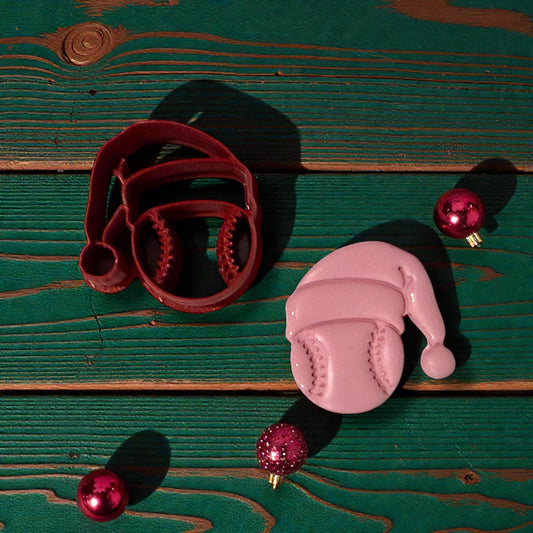 baseball santa clay piece and cutter on green wood