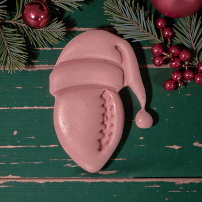 closeup pink football santa clay impression on holiday backdrop
