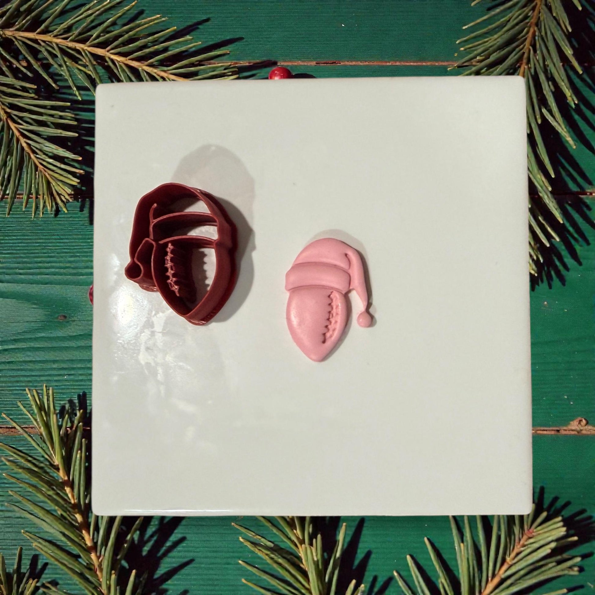 football santa cutter and clay impression on white tile