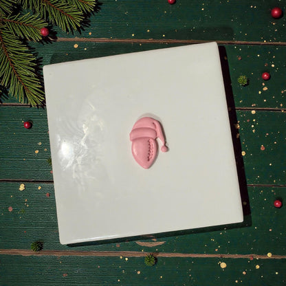 football santa clay piece centered on white tile