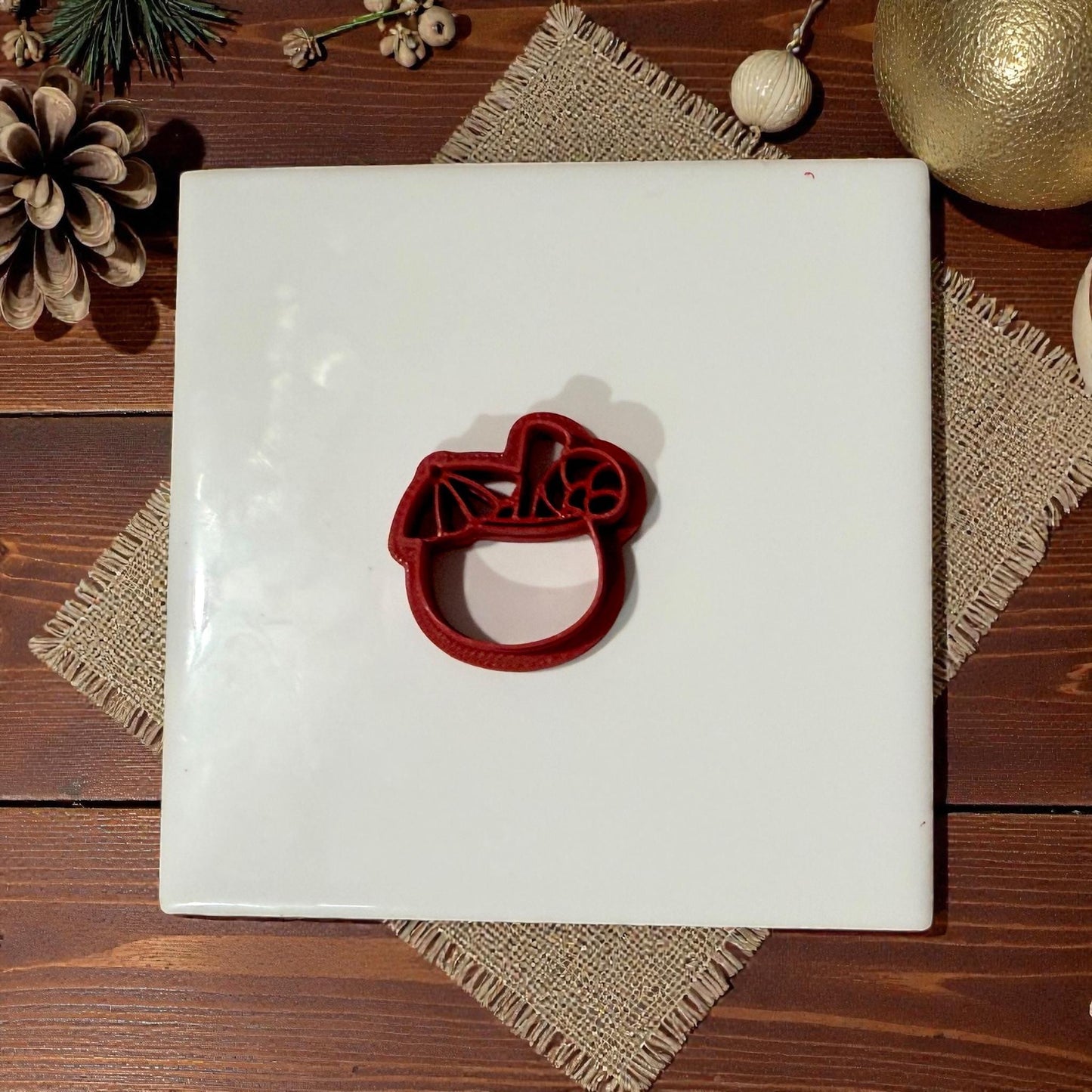 coconut tropical christmas drink cutter centered on white tile
