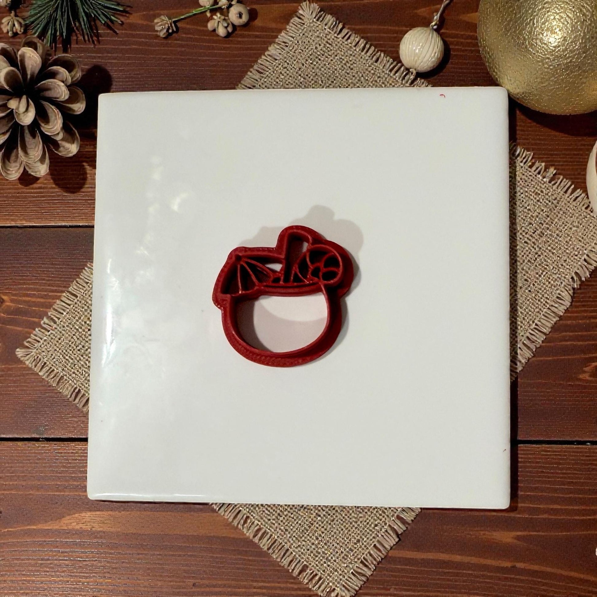 coconut tropical christmas drink cutter centered on white tile