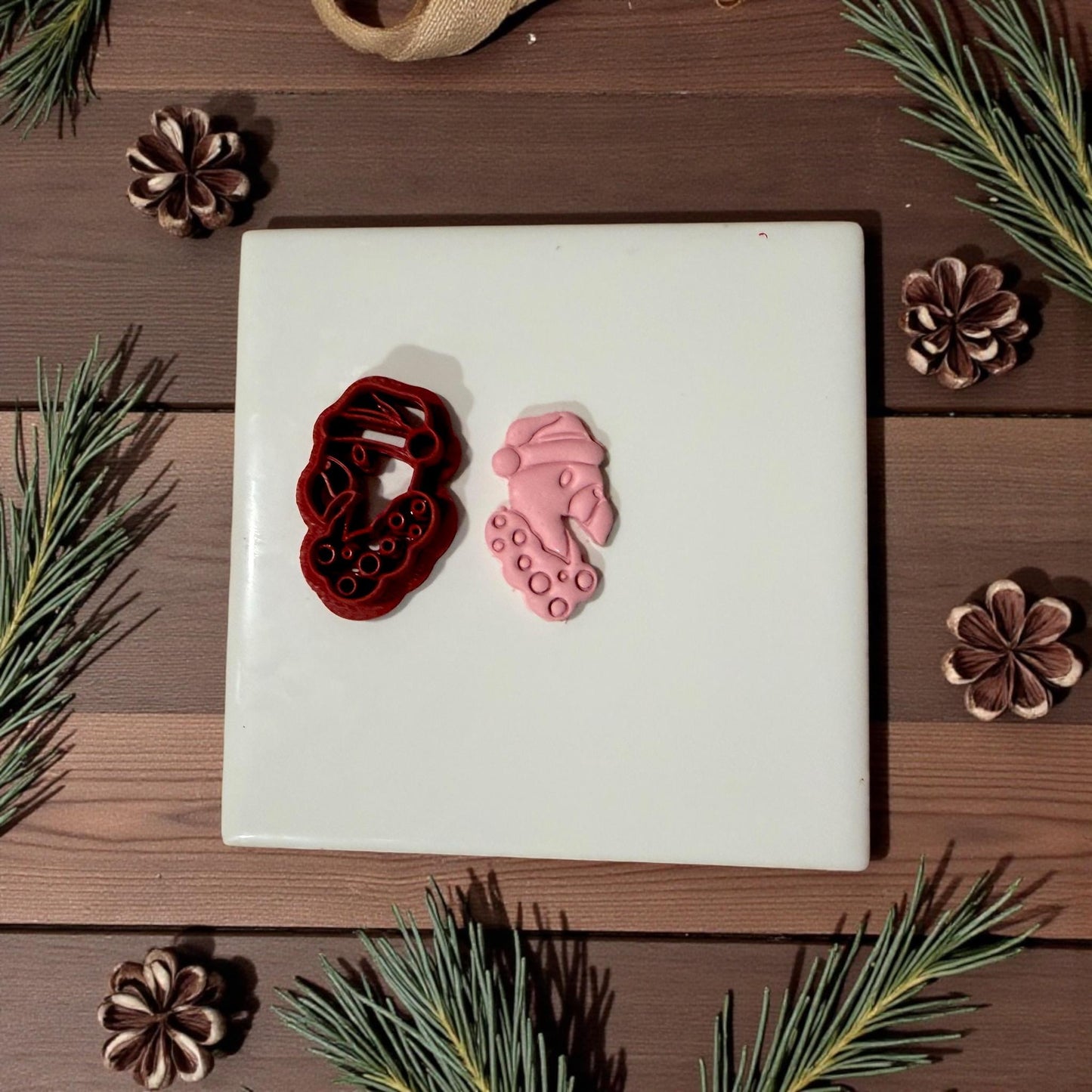 Flamingo cutter and pink clay impression side by side on tile