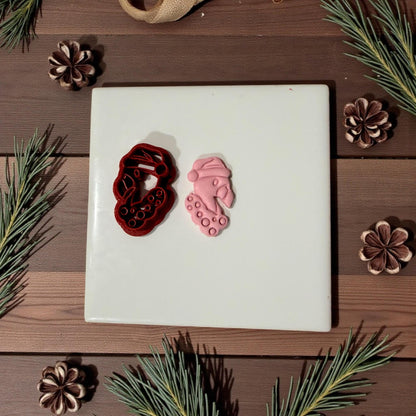 Flamingo cutter and pink clay impression side by side on tile