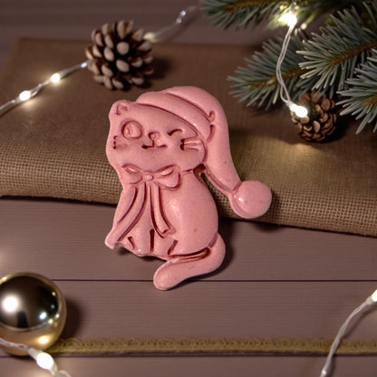 Close-up winter scene with clay kitty standing upright