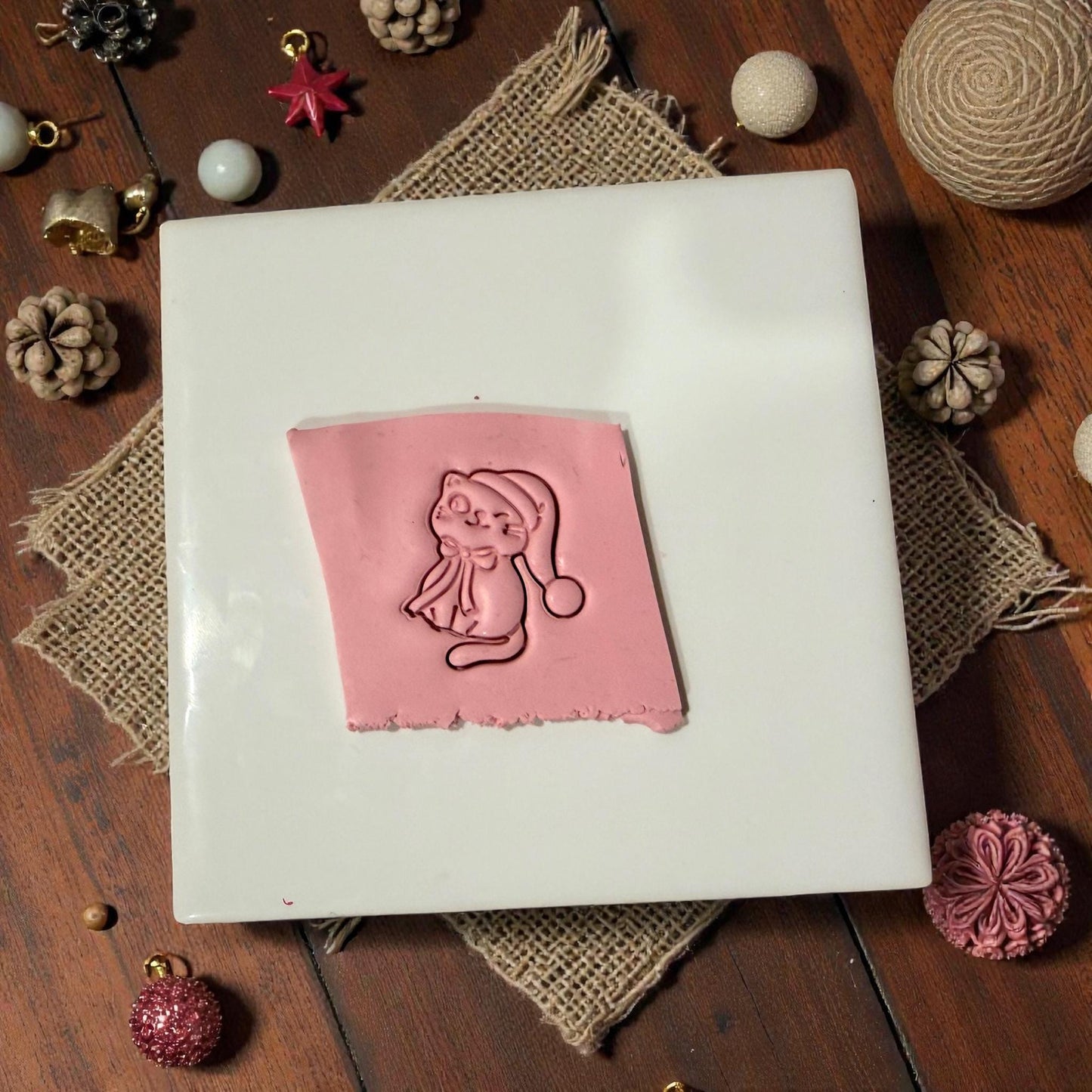 Clay slab impression of Santa hat kitty design