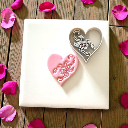 scorpion heart cutter and clay imprint displayed