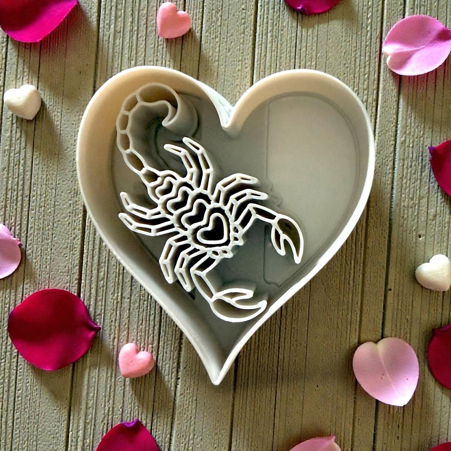 white heart cutter with scorpion details
