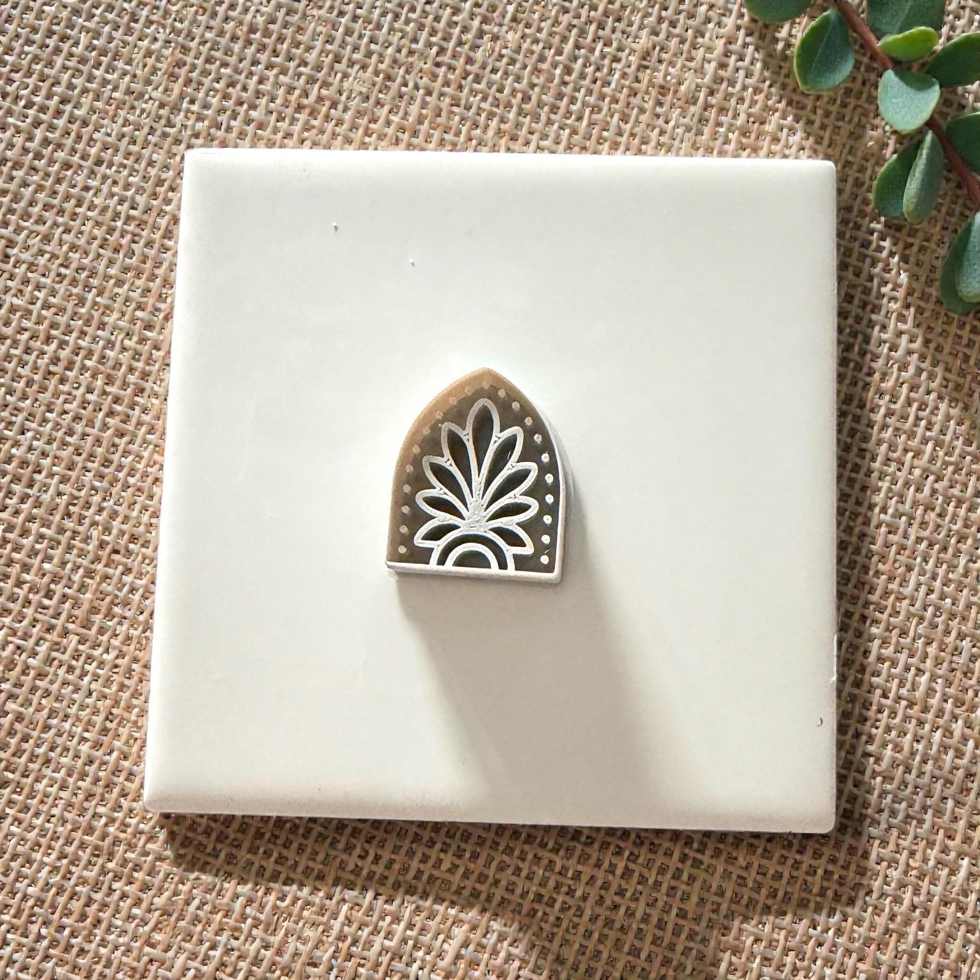 small boho arch clay cutter on white tile