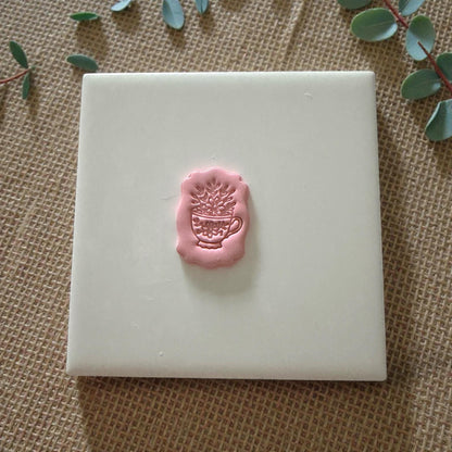small floral teacup clay impression on white tile