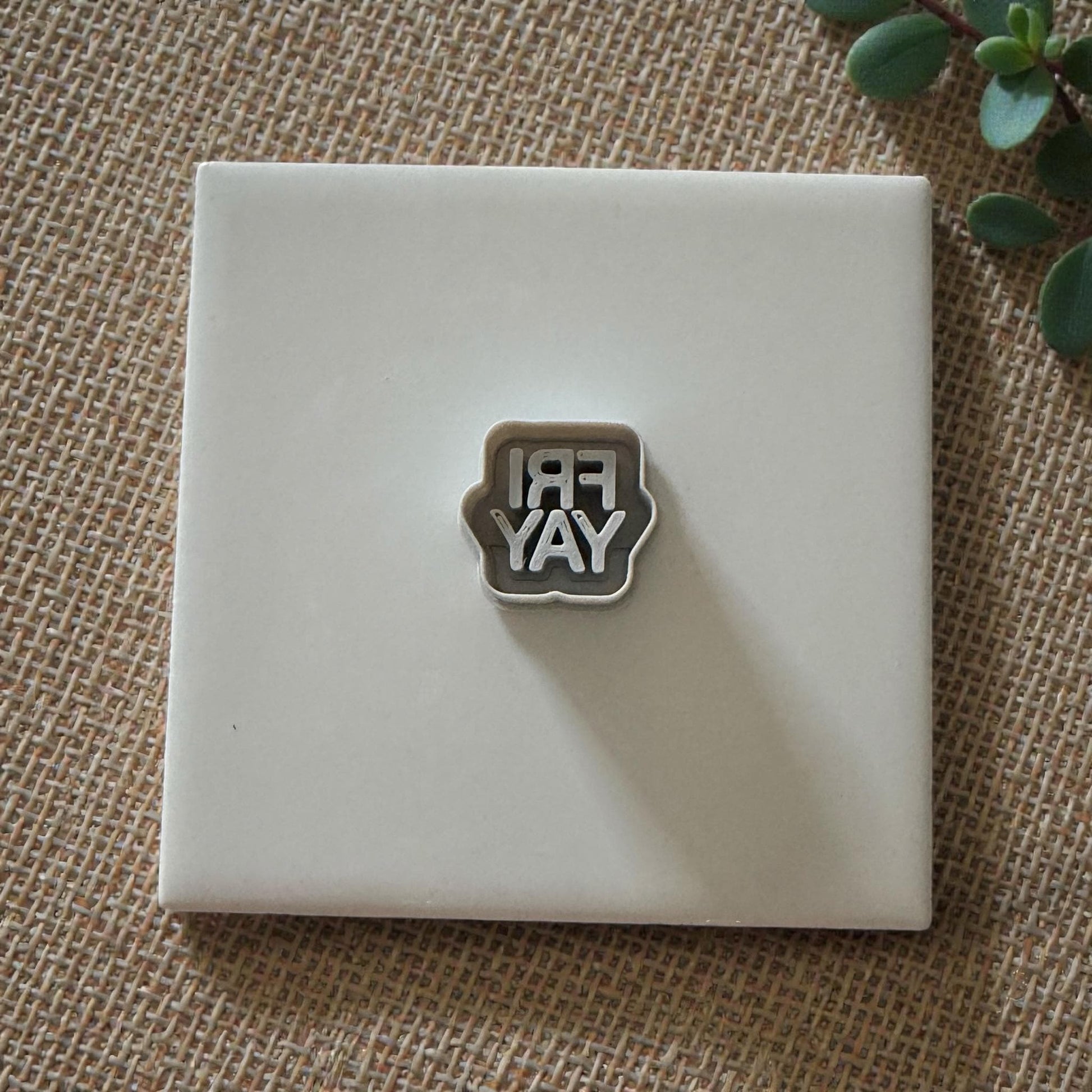 Small FRIYAY cutter displayed on white tile