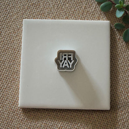 Small FRIYAY cutter displayed on white tile