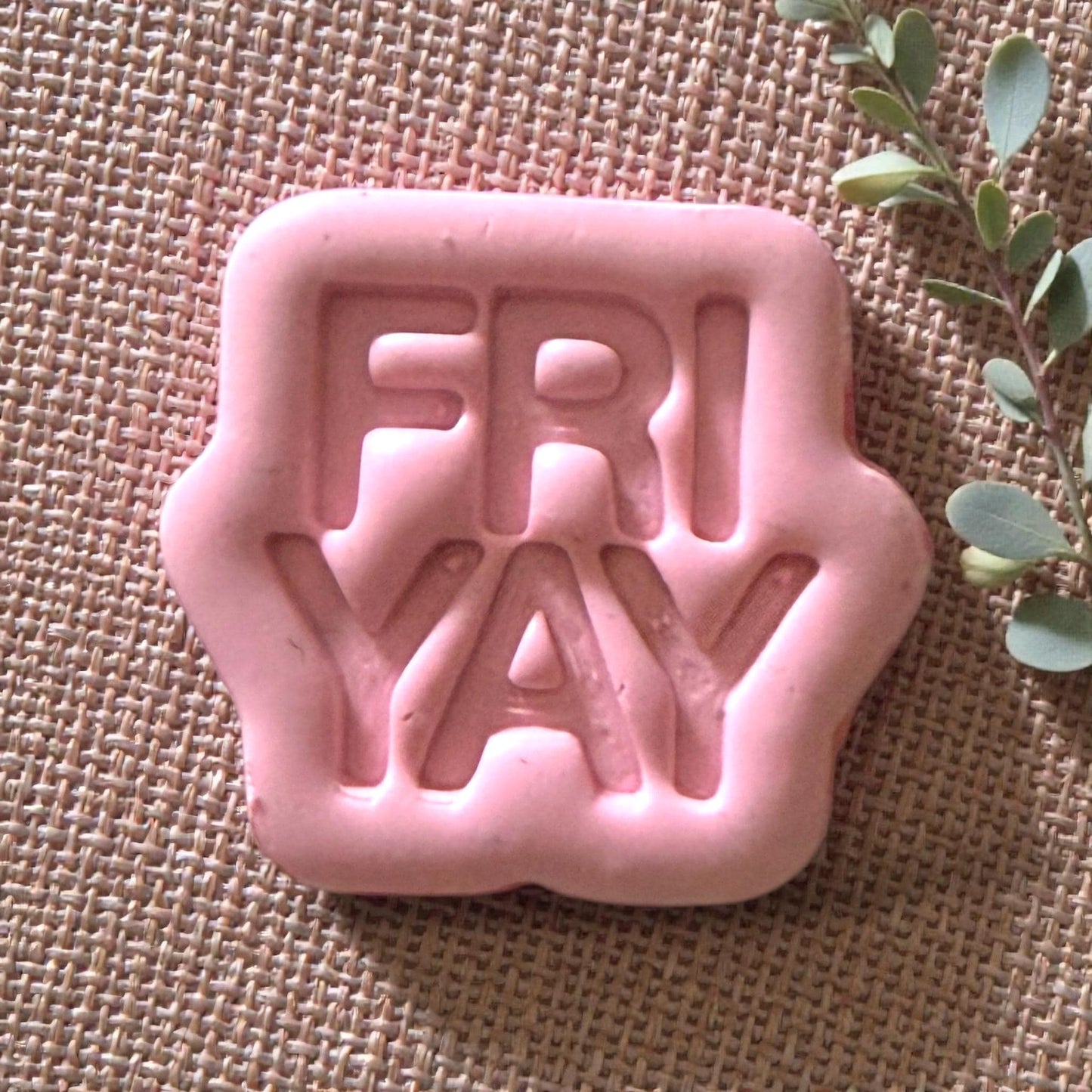 Close-up of pink FRIYAY clay impression