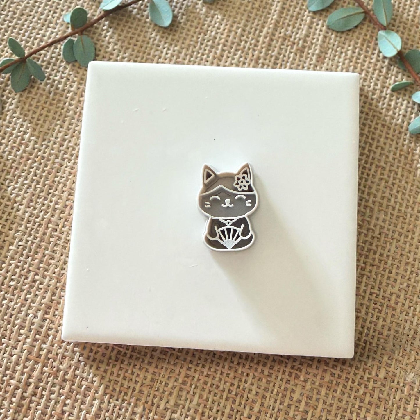 small kawaii cat clay cutter shown on white tile