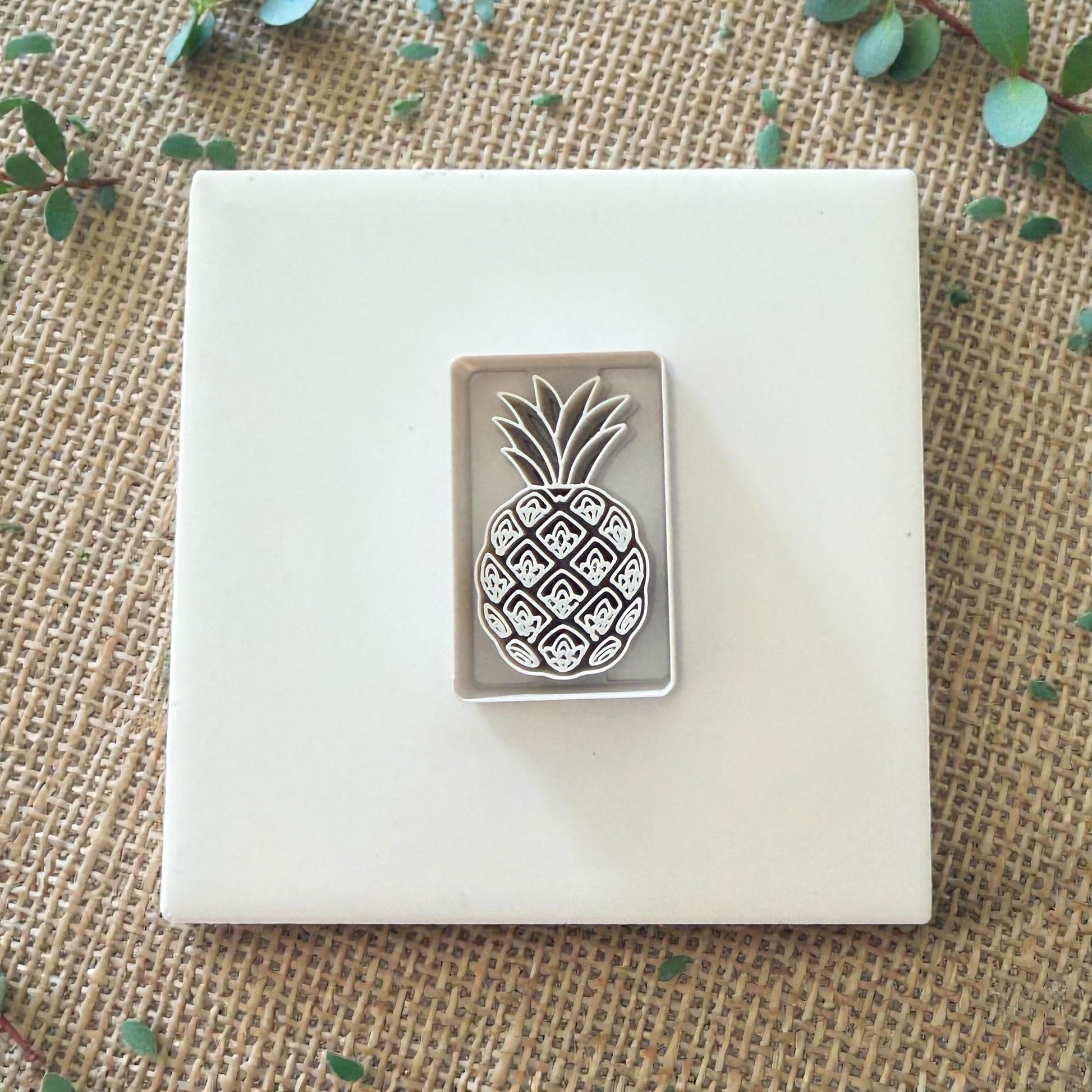 polymer clay pineapple cutter on white tile