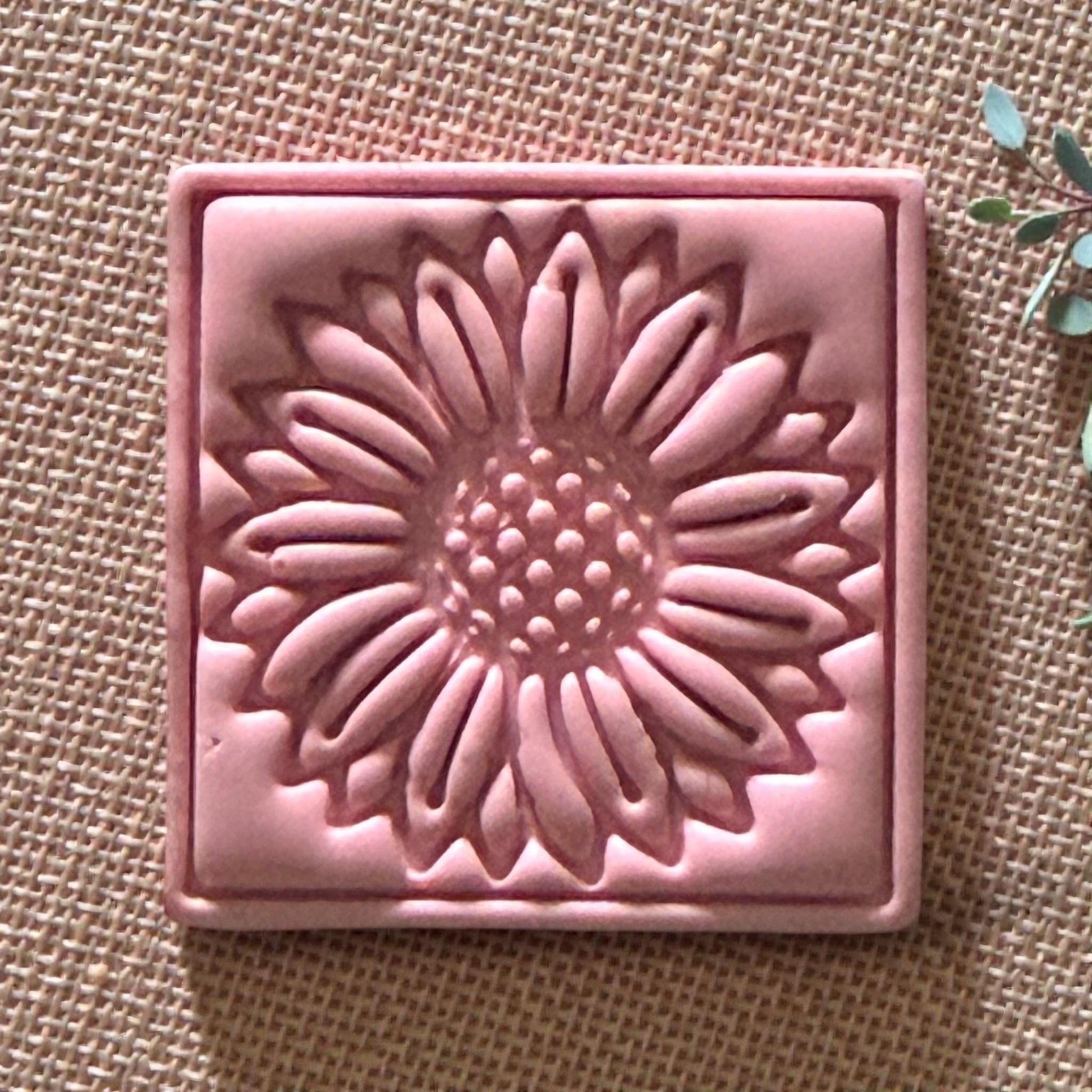 close-up of pink sunflower clay impression showing petal details