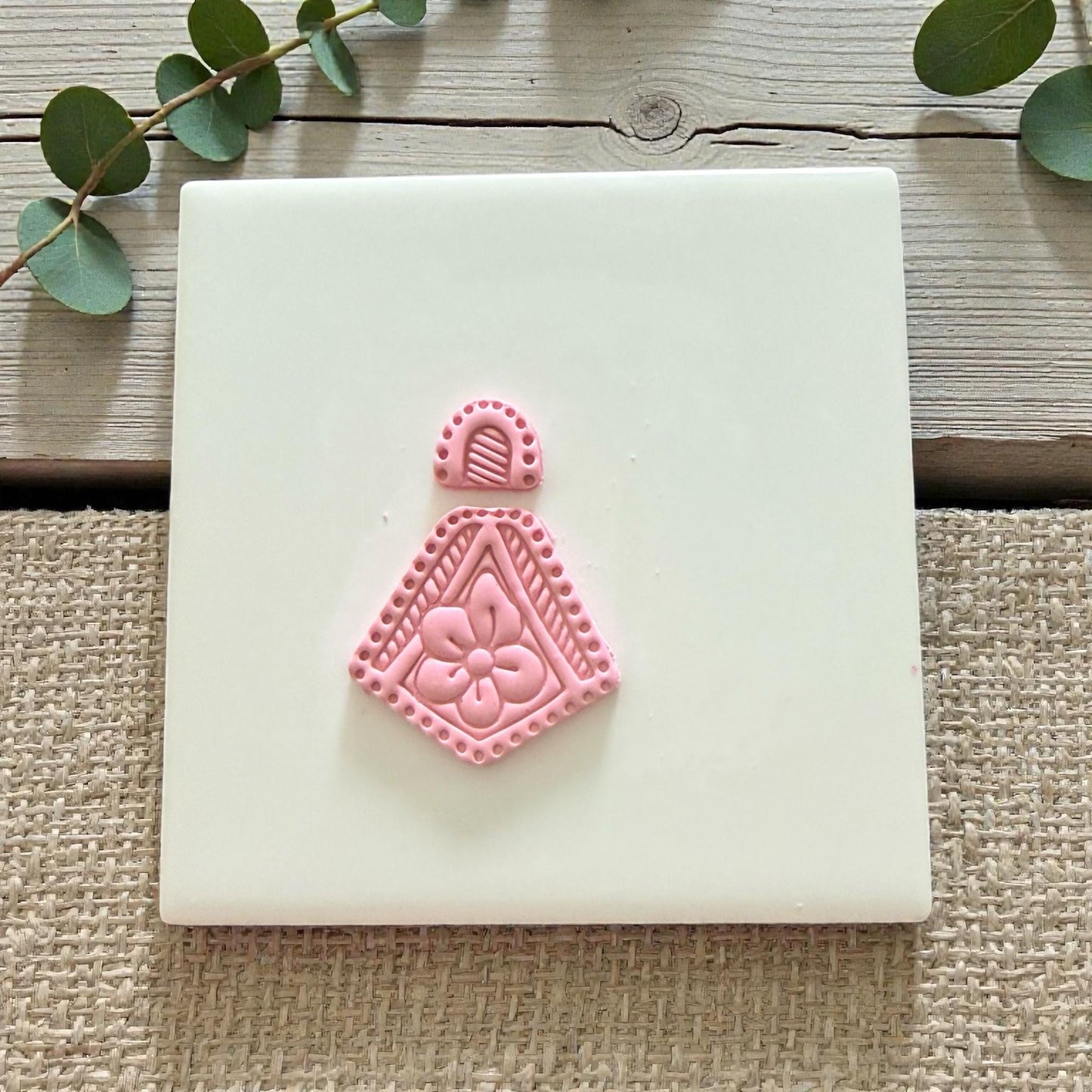 flower cutter imprint on white tile