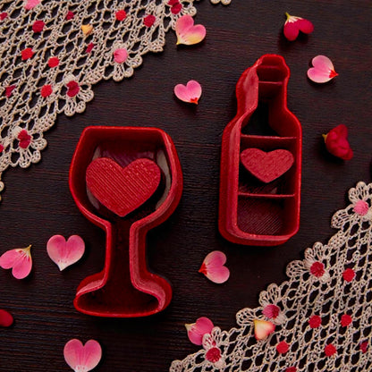 Wine glass and bottle cutters styled with lace and pink petals