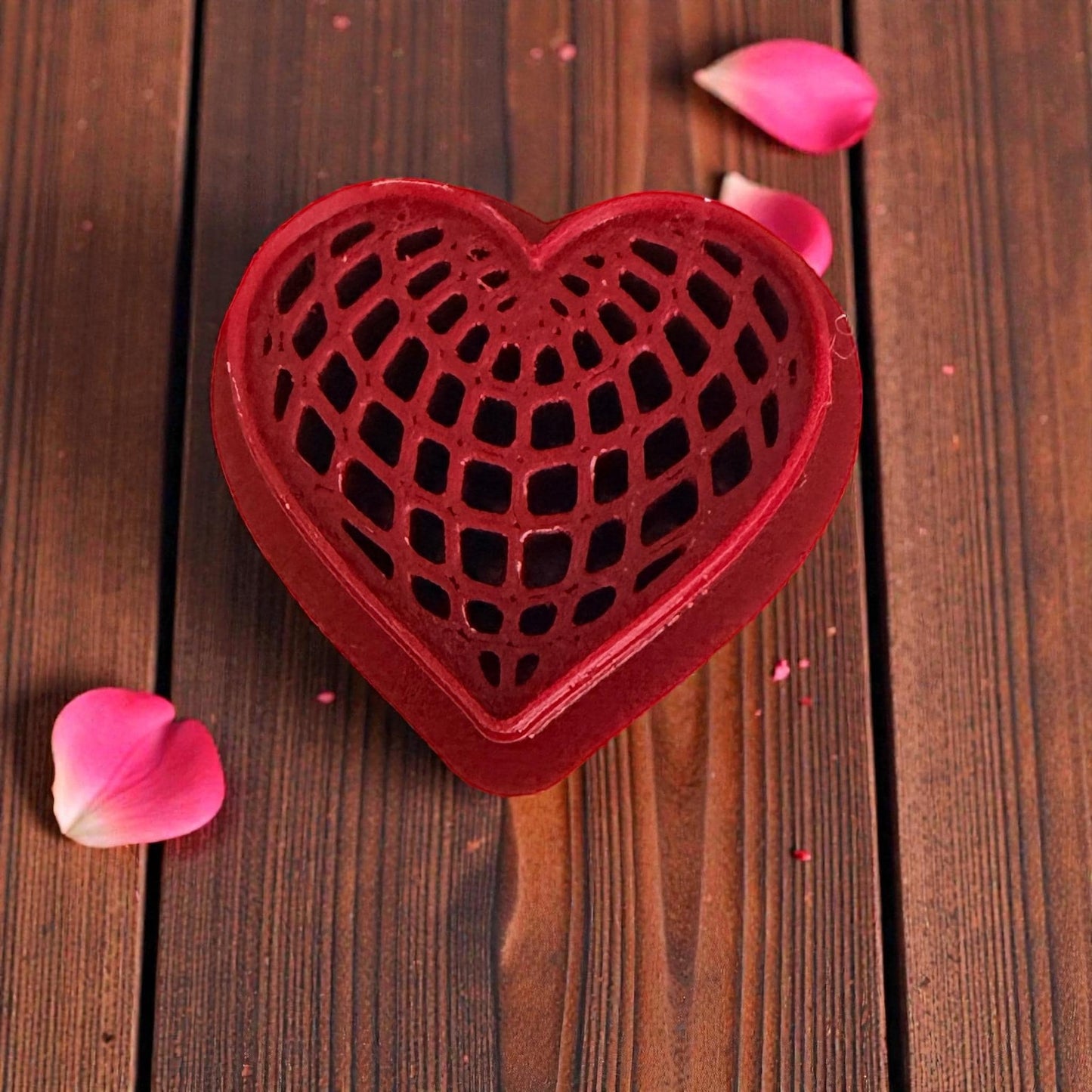close-up red heart web texture cutter on wooden background